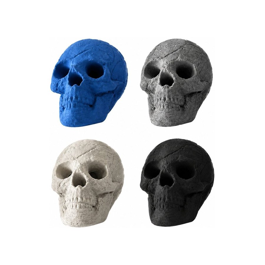 Four skull shaped fire starters in blue, grey, beige and black