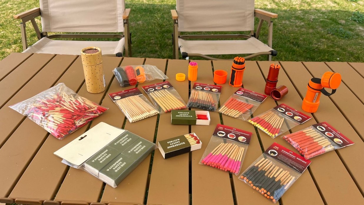 Packaging formats, pack counts and labels all need to be confirmed in writing Range of match products laid out on a camping table: blister packs, printed boxes, tubes and loose bundles